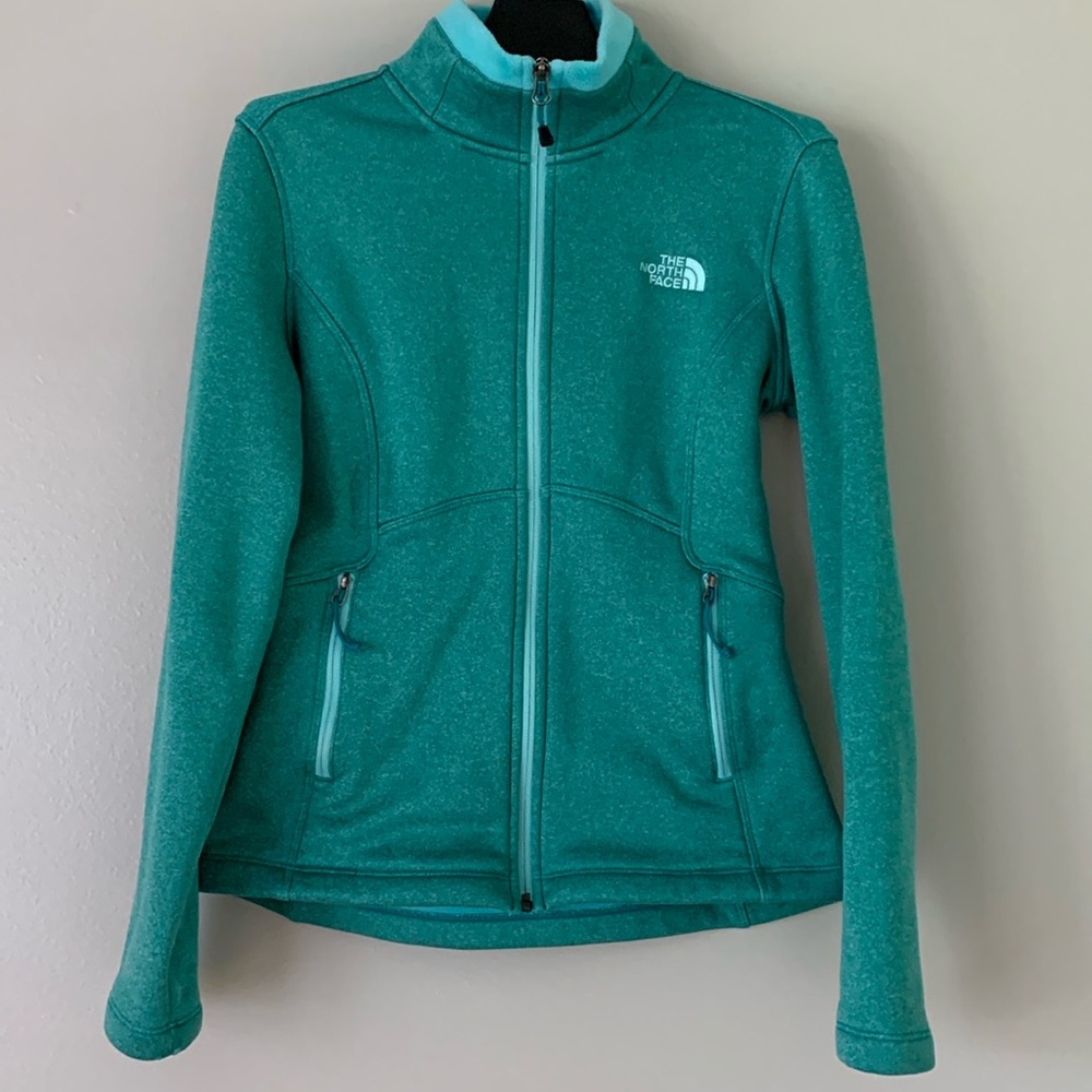 The North Face full zip jacket size XS.  Smooth exterior, super soft interior